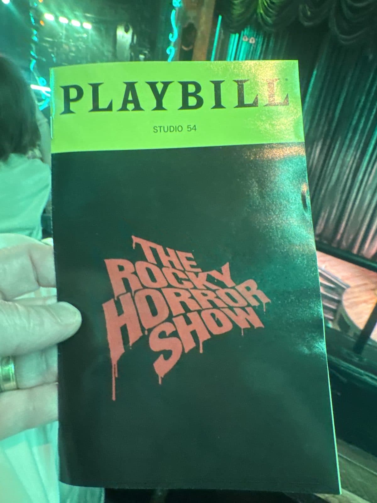 Playbill for The Rocky Horror Show at Studio 54, held up inside the theater